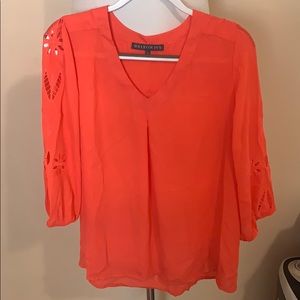 Bright coral blouse, cut out design on sleeves